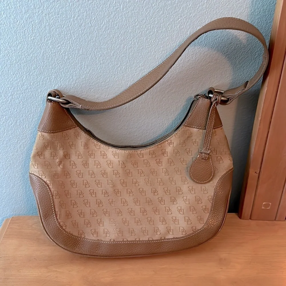 Dooney and Bourke classic monogram canvas and leather Tan color small hobo bag